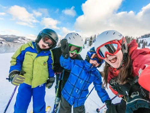 mom and kids skiing