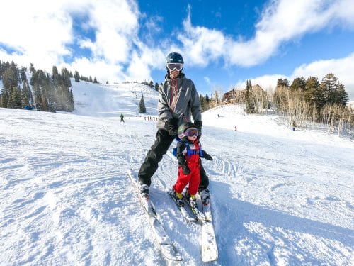 dad and baby skiing