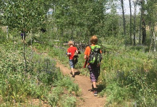 kids hiking with backpack