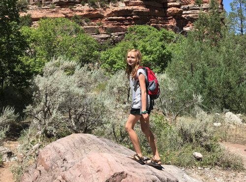 girl hiking with backpack