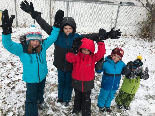 kids in snow with gloves and mittens on