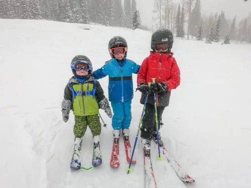 little boys skiing together
