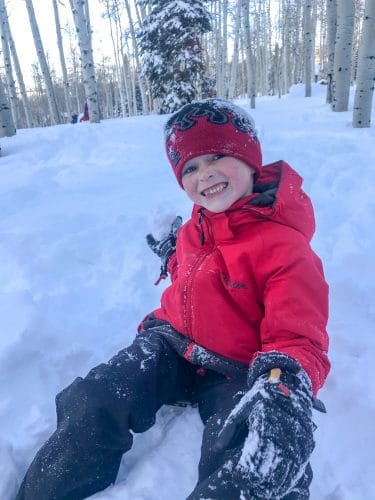 Boy playing in snow