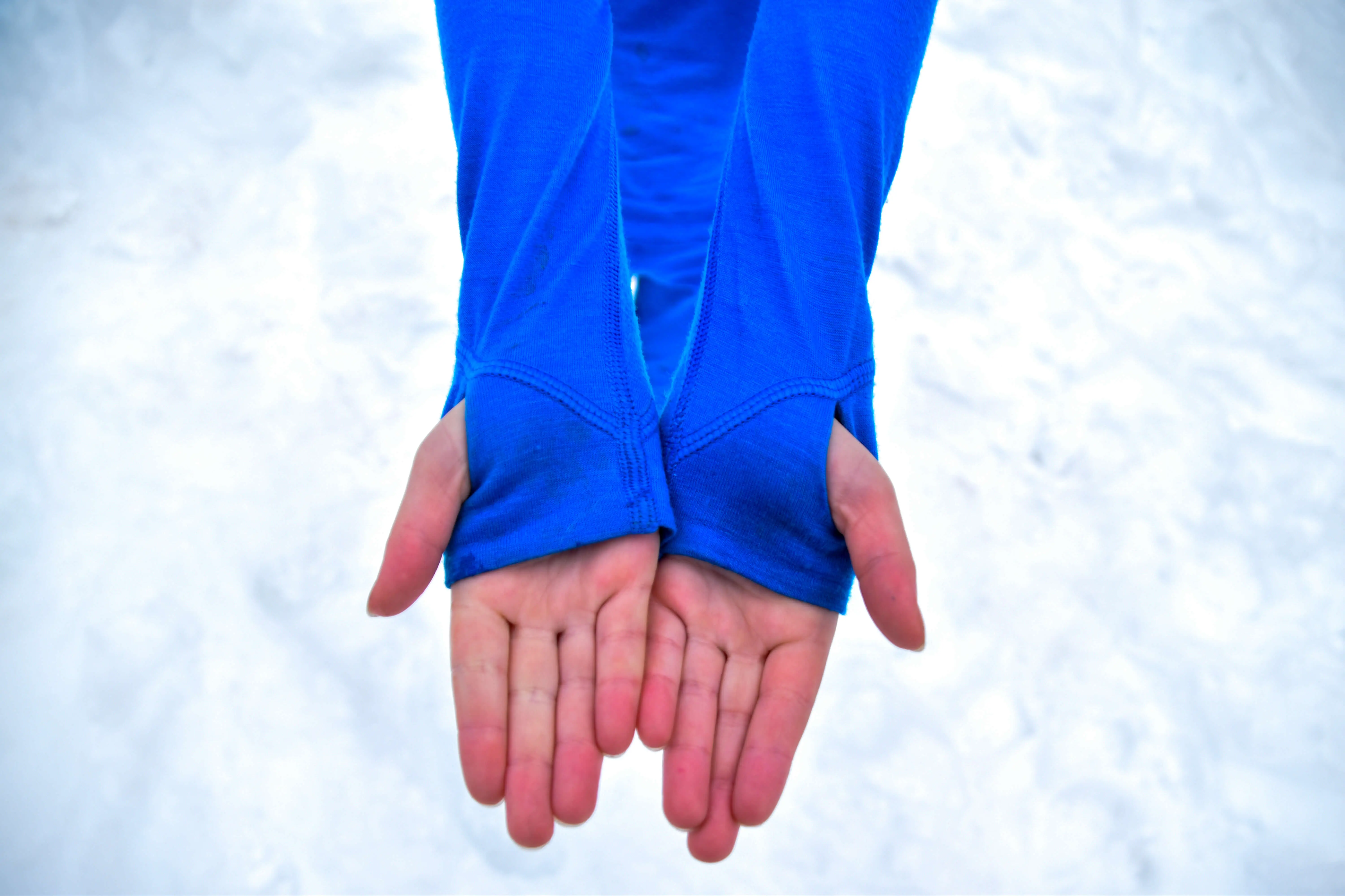 boy in the mountains in winter iksplor thumb holes