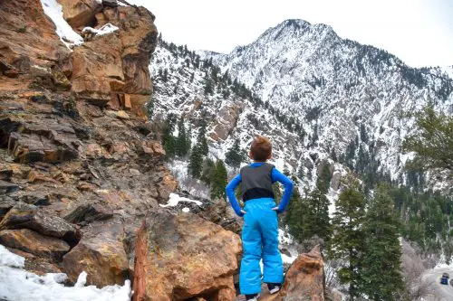 boy in the mountains in winter