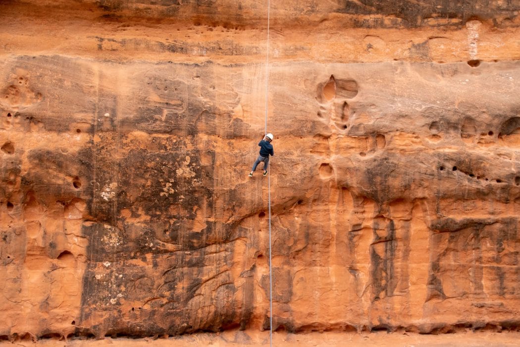 boy canyoneering rapelling in moab