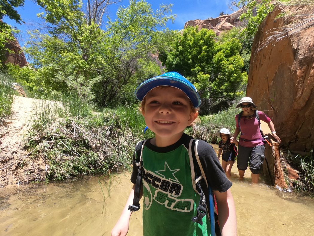 little boy with camelbak