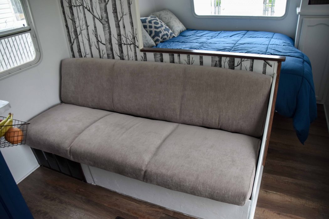 reupholstered RV sofa with access panel