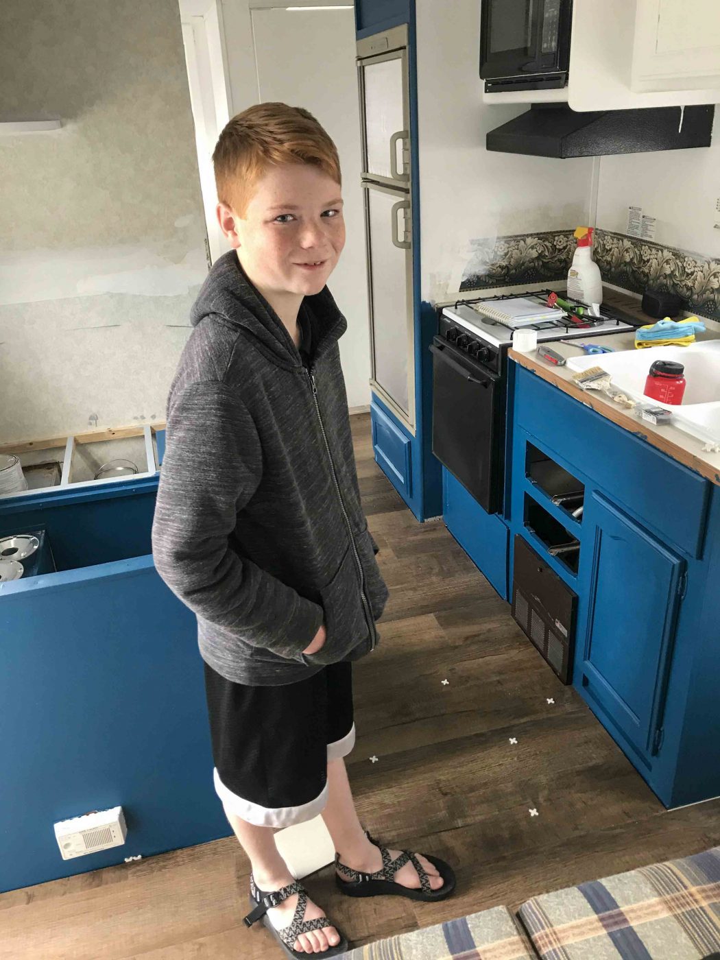 kid installing vinyl plank floors