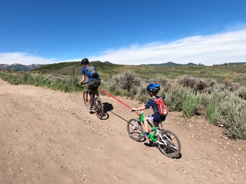 riding uphill with the tow whee strap