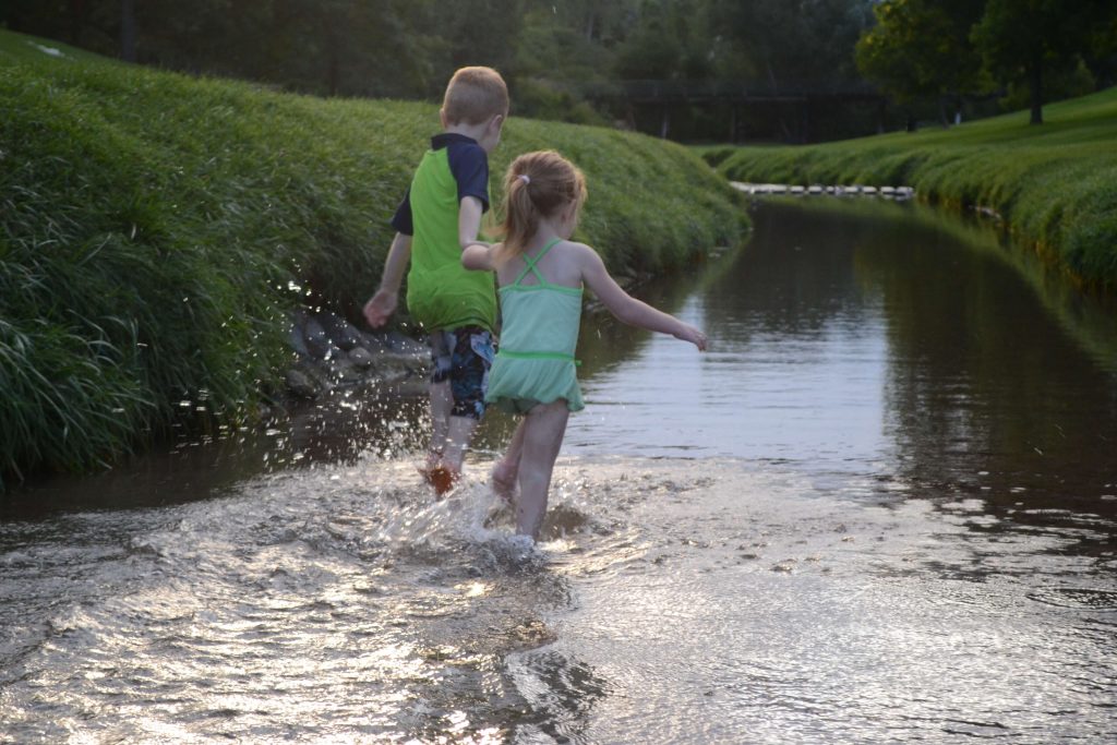 playing in the river while camping