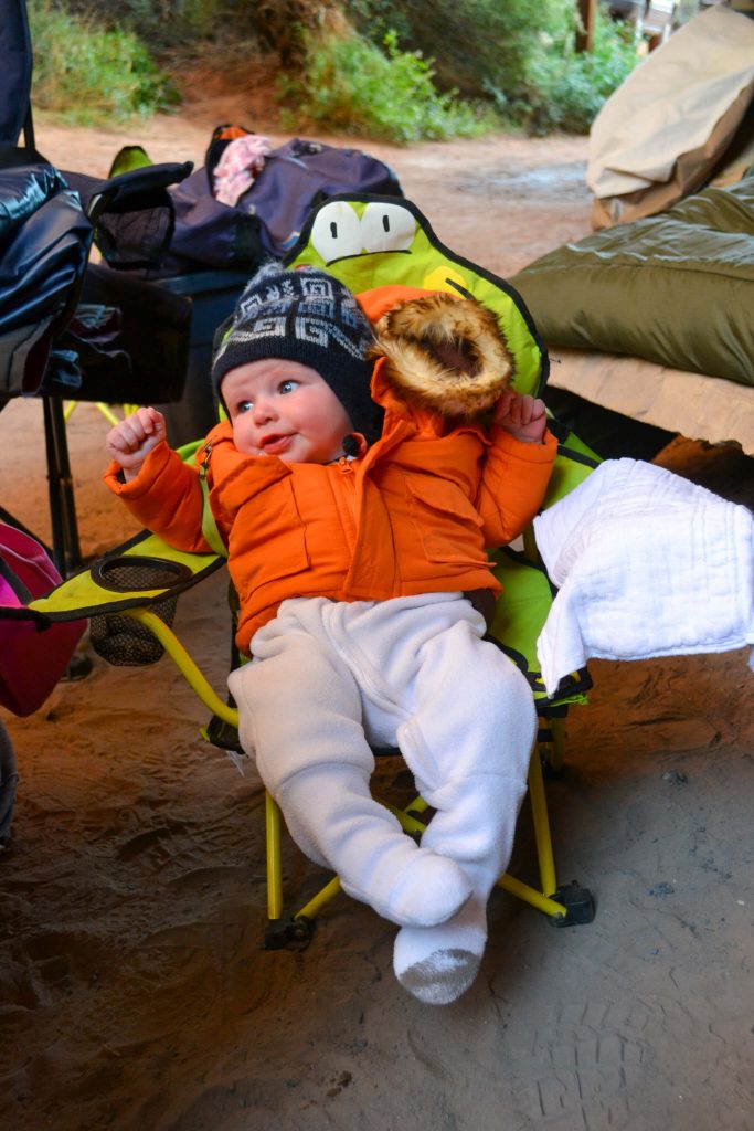 baby dressed warm for camping