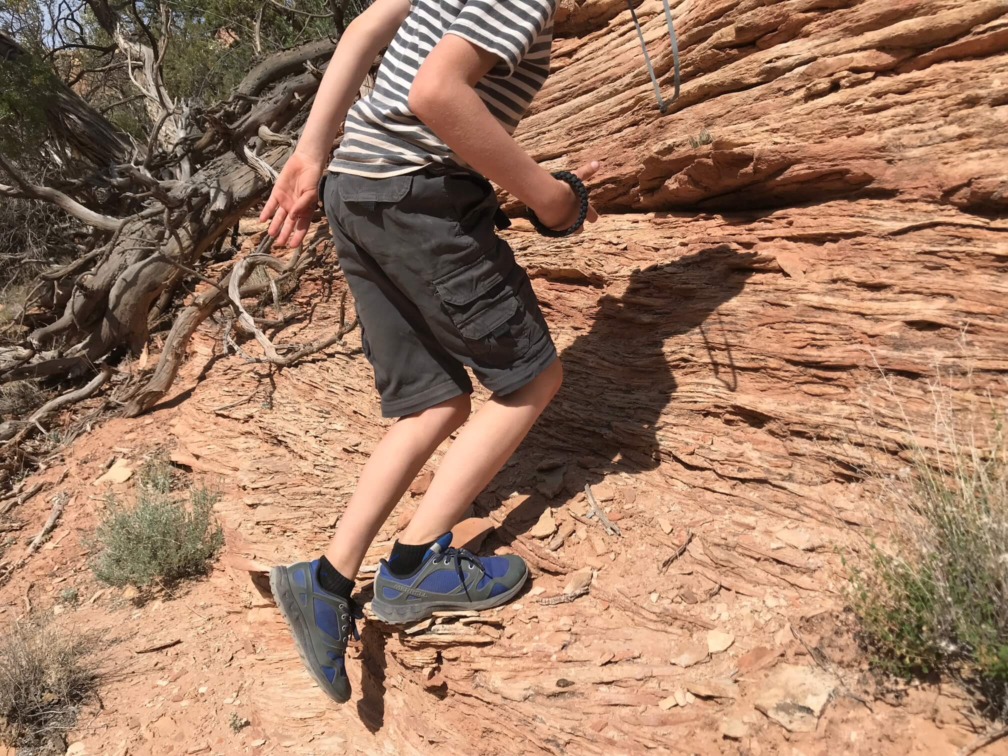 climbing rocks with hiking shoes on