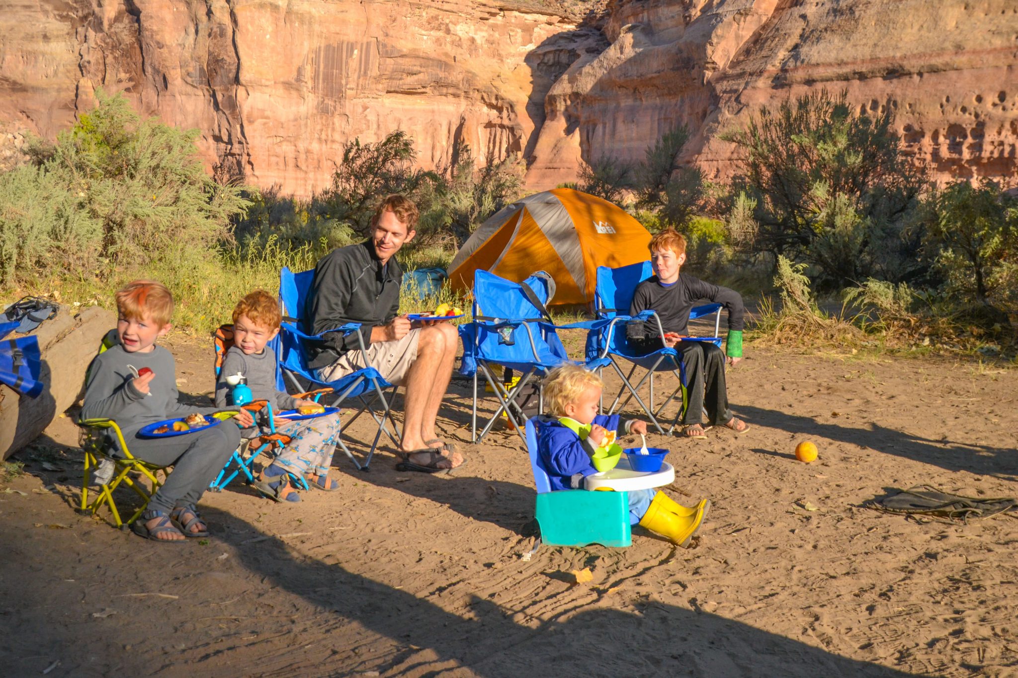 camping with a baby and family outside