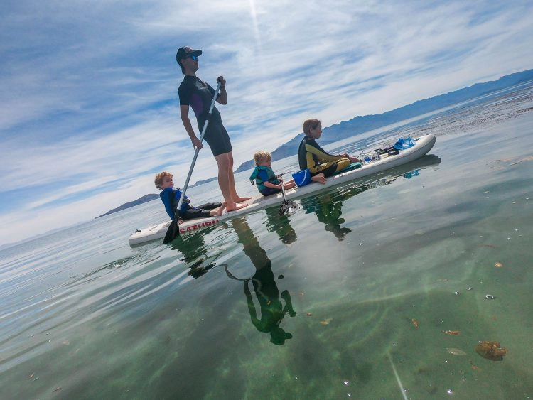 kids wearing wetsuits in the mountains