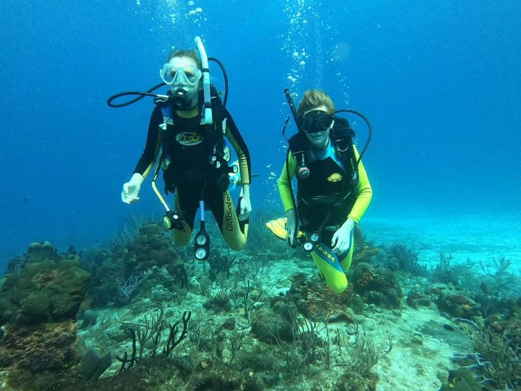 kids scuba diving with wetsuits