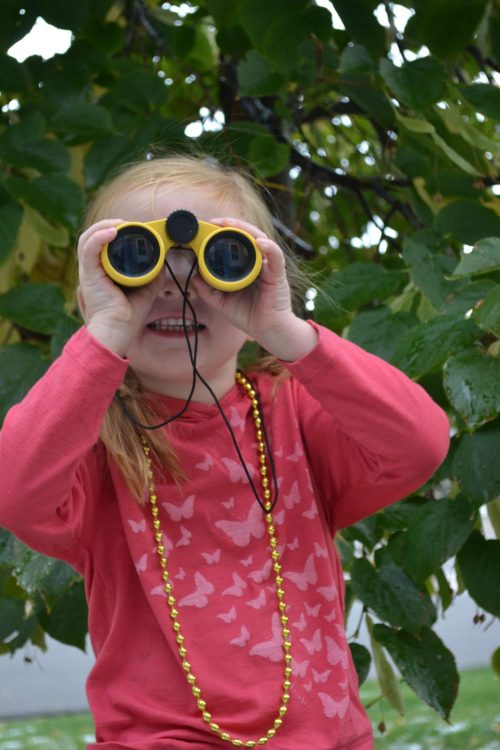 little girl with binoculars