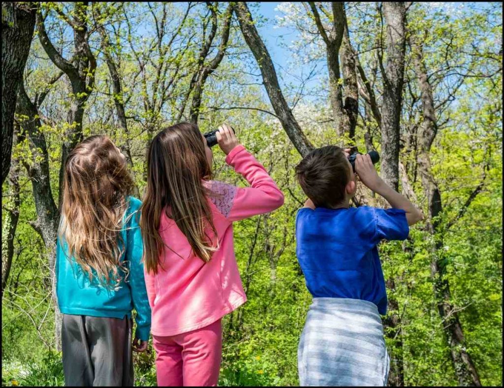 little kids with binoculars