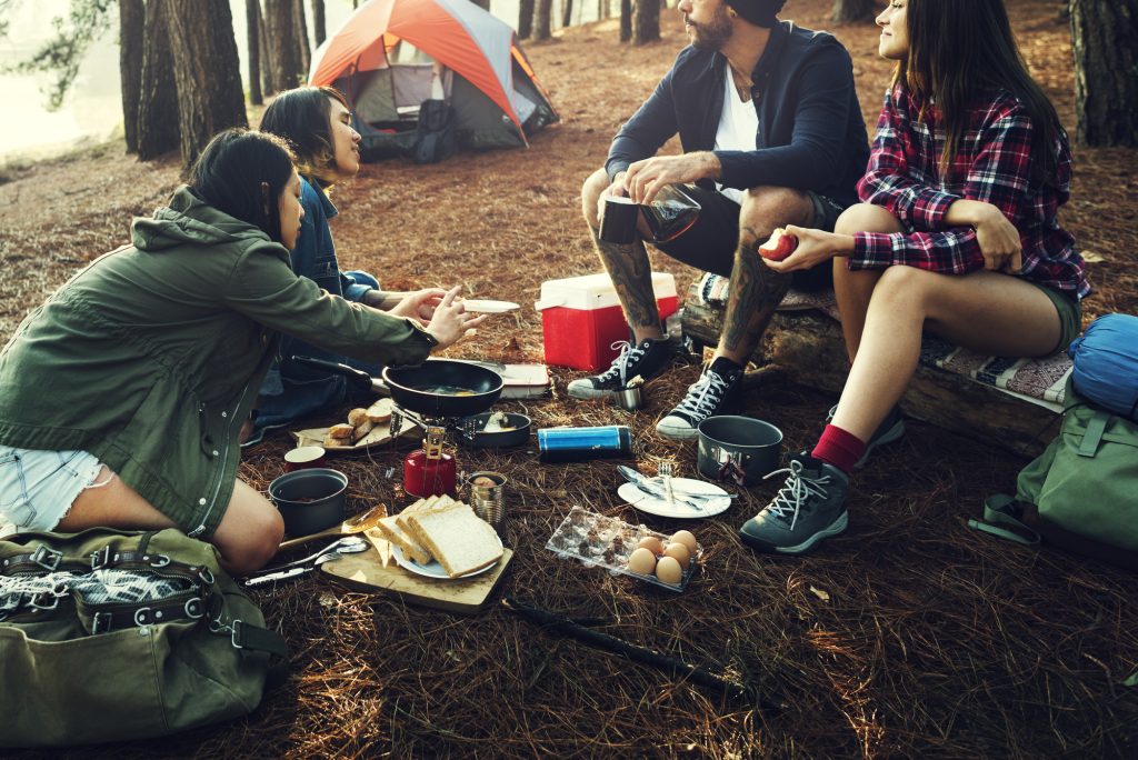 friends using incredible camping mugs