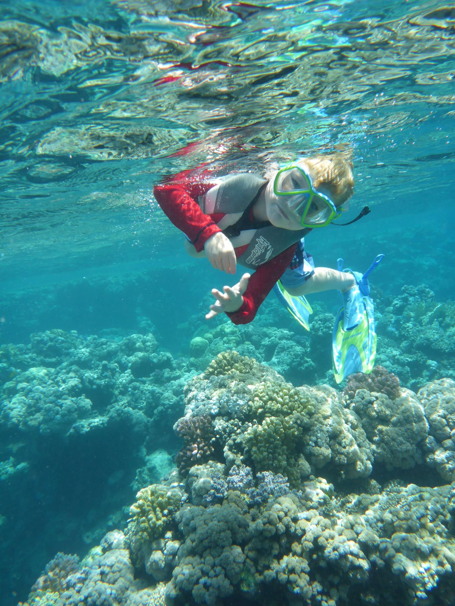 kids wearing a life jacket while snorkeling