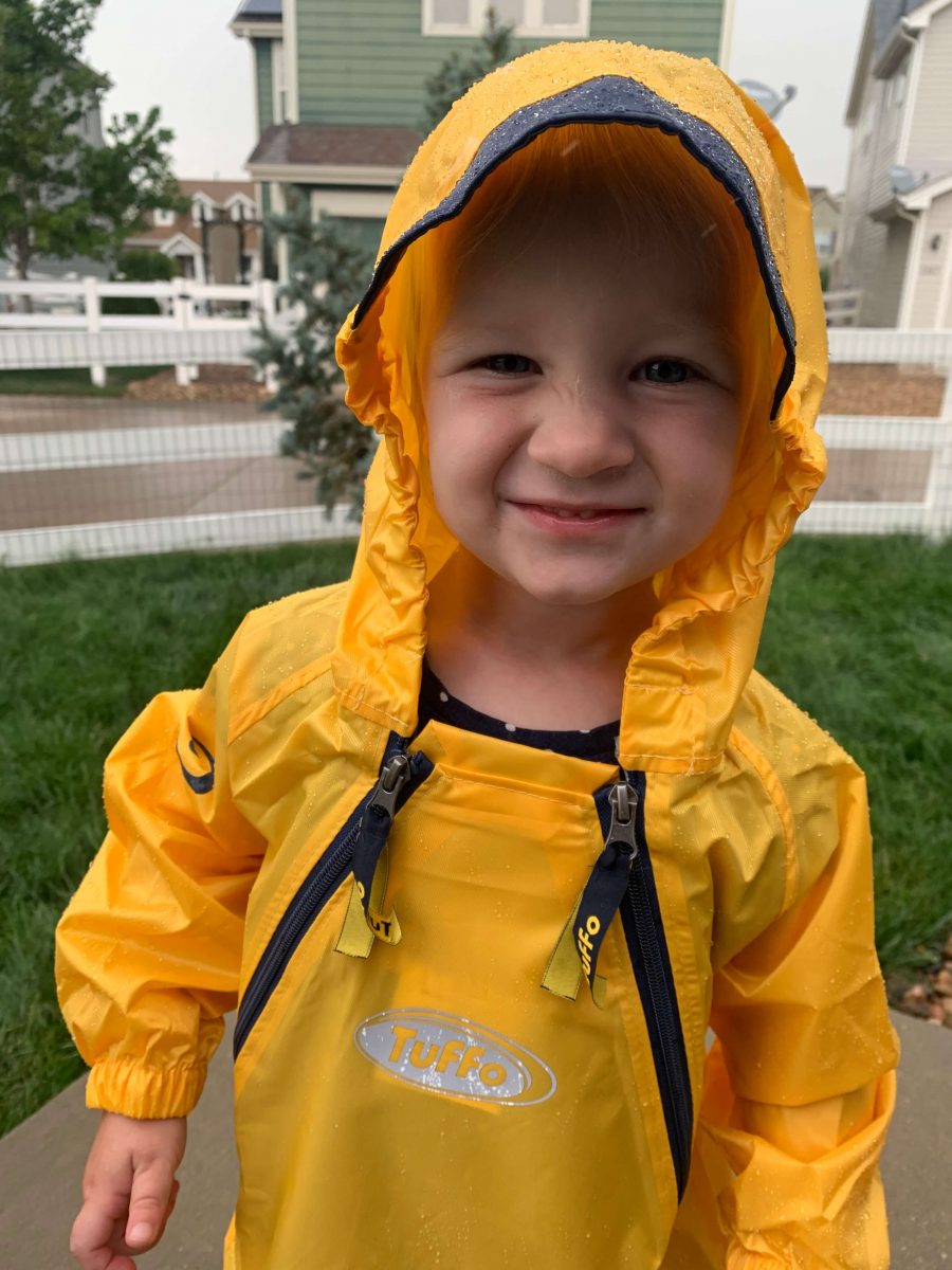 Toddler playing in rain in Muddy Buddy Coverall